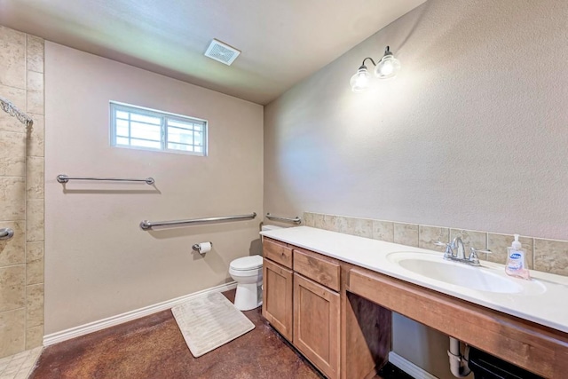 bathroom featuring toilet and sink