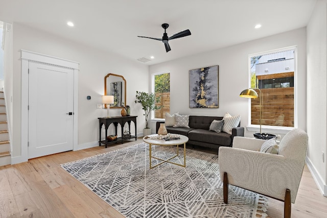 living area featuring visible vents, a ceiling fan, light wood-style flooring, and recessed lighting