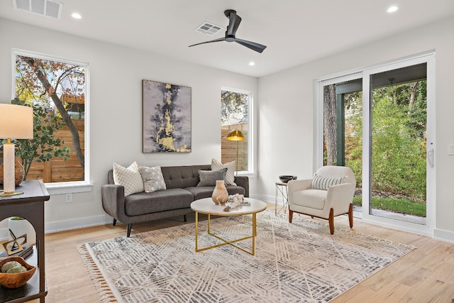 sitting room featuring ceiling fan and light hardwood / wood-style floors