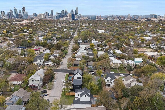 birds eye view of property with a view of city