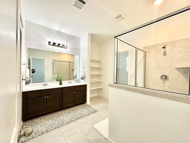 bathroom featuring vanity and a tile shower