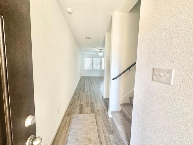 corridor featuring light hardwood / wood-style flooring