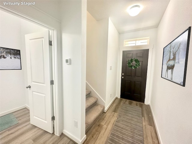 foyer entrance featuring light hardwood / wood-style flooring