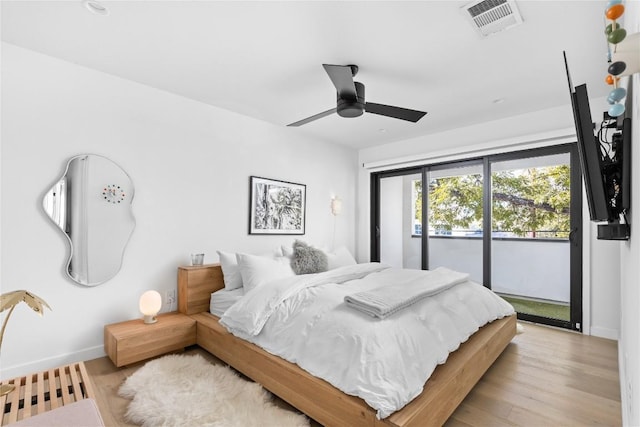 bedroom with ceiling fan, light hardwood / wood-style floors, and access to exterior