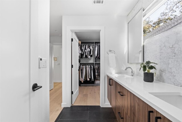 bathroom featuring vanity and wood-type flooring