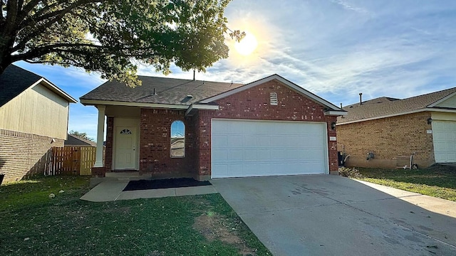 view of front facade featuring a garage and a front yard