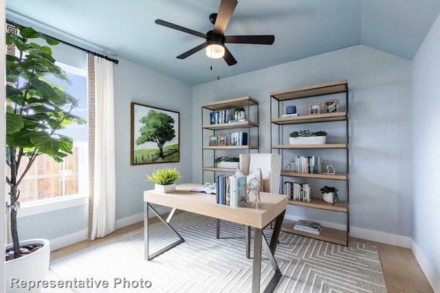 office area featuring ceiling fan, wood-type flooring, and lofted ceiling