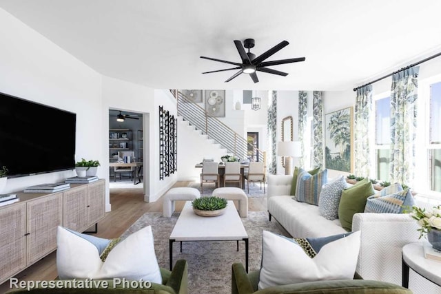 living room with hardwood / wood-style floors and plenty of natural light