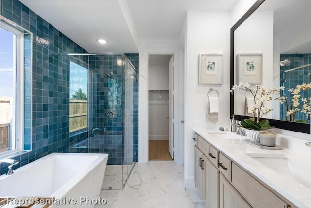 bathroom featuring vanity and plus walk in shower