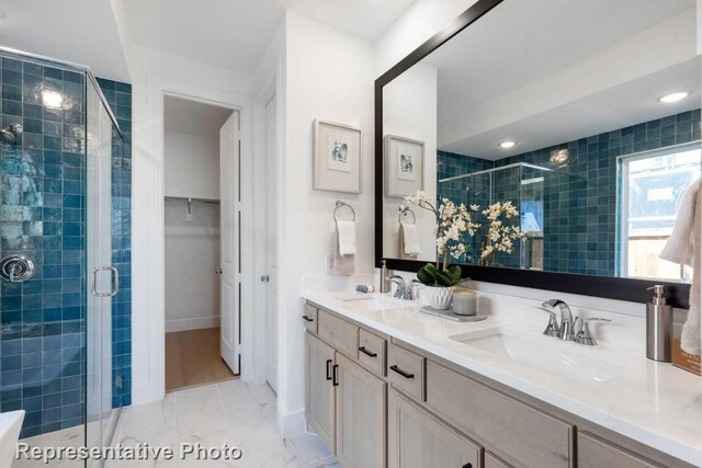 bathroom featuring vanity and walk in shower