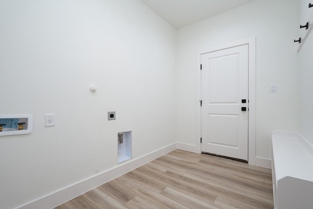 clothes washing area with electric dryer hookup, gas dryer hookup, hookup for a washing machine, and light wood-type flooring