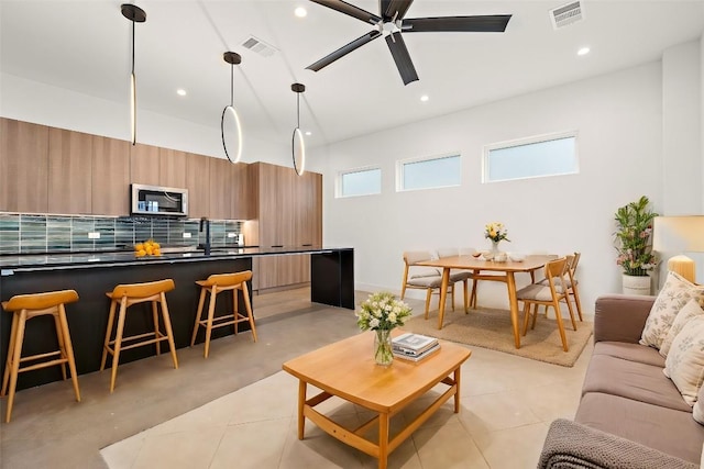 living room with ceiling fan