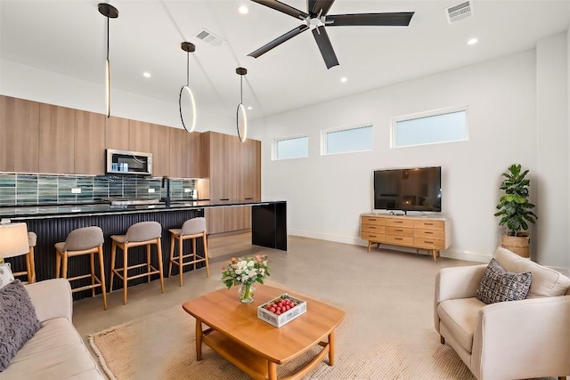 living room with ceiling fan