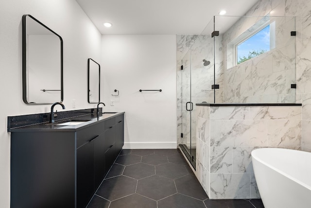 bathroom featuring tile patterned flooring, vanity, and separate shower and tub