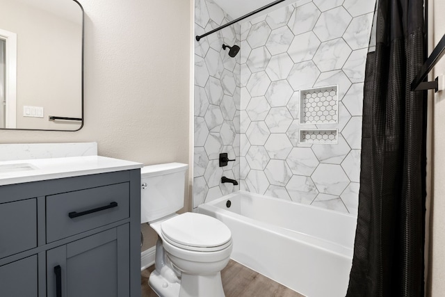 full bathroom featuring shower / bath combo with shower curtain, toilet, wood-type flooring, and vanity