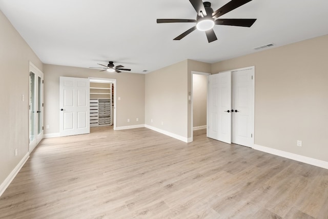 interior space with ceiling fan and light wood-type flooring