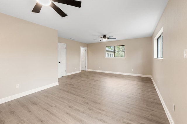 spare room featuring ceiling fan and light hardwood / wood-style flooring