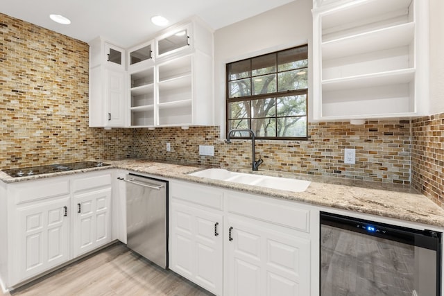 kitchen with dishwasher, white cabinets, sink, black electric cooktop, and beverage cooler