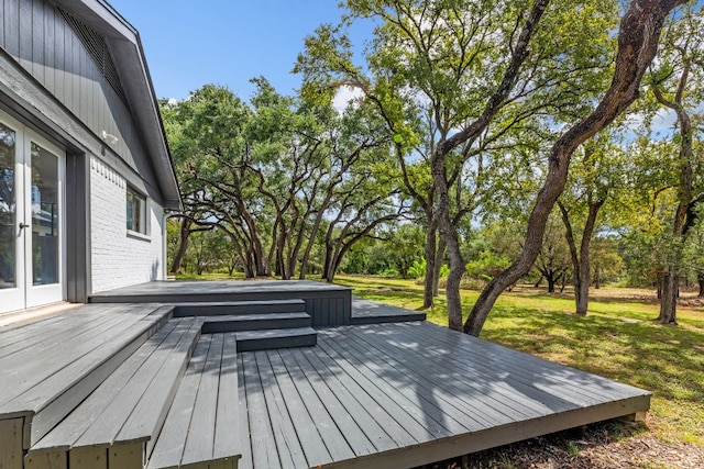 wooden terrace with a yard