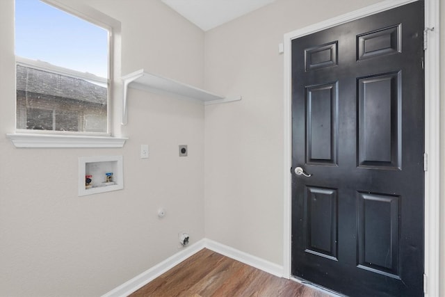 laundry room with electric dryer hookup, dark wood-type flooring, and washer hookup