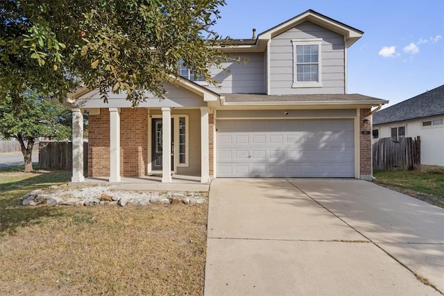 view of front property featuring covered porch and a garage