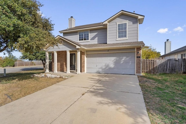 view of front of home featuring covered porch and a garage