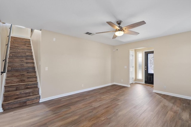 spare room featuring dark hardwood / wood-style floors and ceiling fan