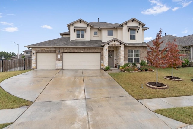 view of front of home featuring a garage and a front lawn