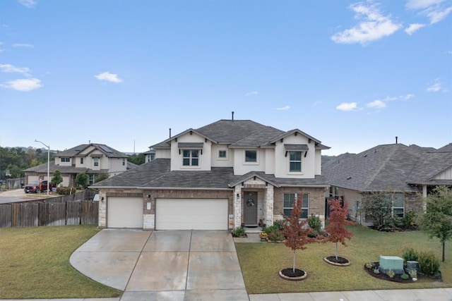 view of front of house with a front yard and a garage