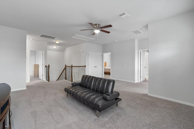 sitting room featuring light carpet and ceiling fan