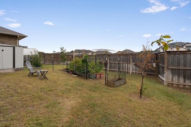 view of yard with a storage unit