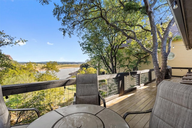 wooden deck with a water view