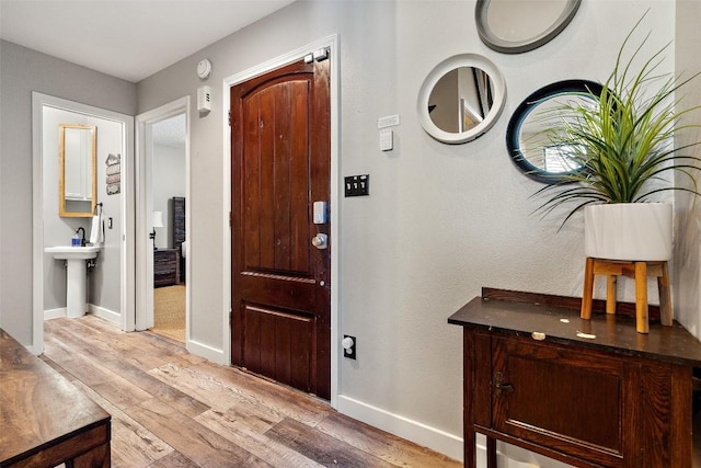 106 Center Cove Ii Loop, Spicewood, TX 78669 - foyer with light wood-style floors and baseboards
