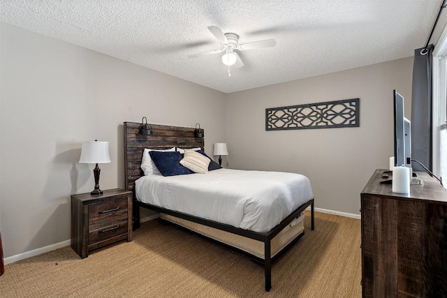 106 Center Cove Ii Loop, Spicewood, TX 78669 - bedroom featuring light carpet, baseboards, a textured ceiling, and a ceiling fan