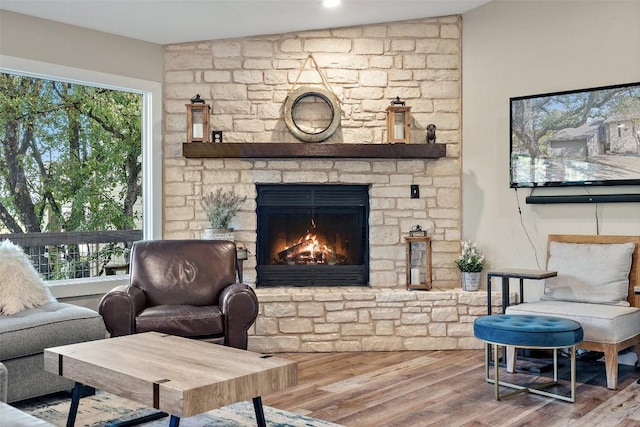 106 Center Cove Ii Loop, Spicewood, TX 78669 - living area with a fireplace and wood finished floors