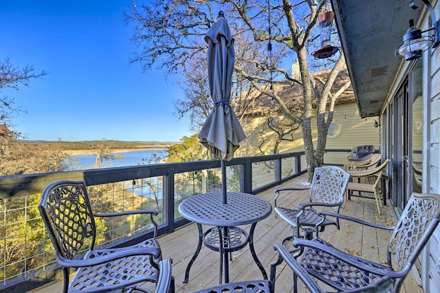 wooden terrace with a water view