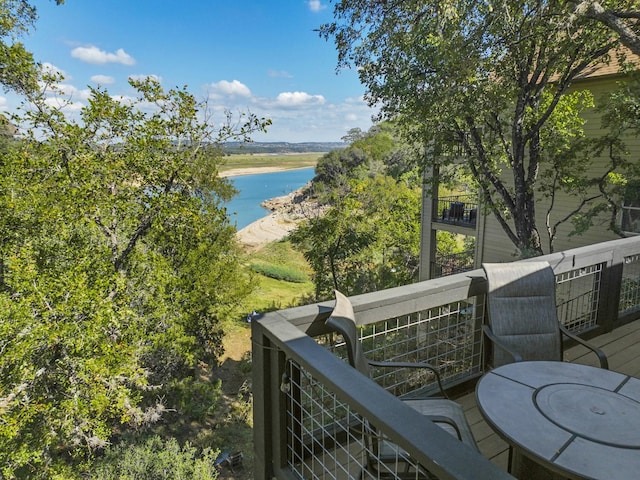 balcony featuring a water view