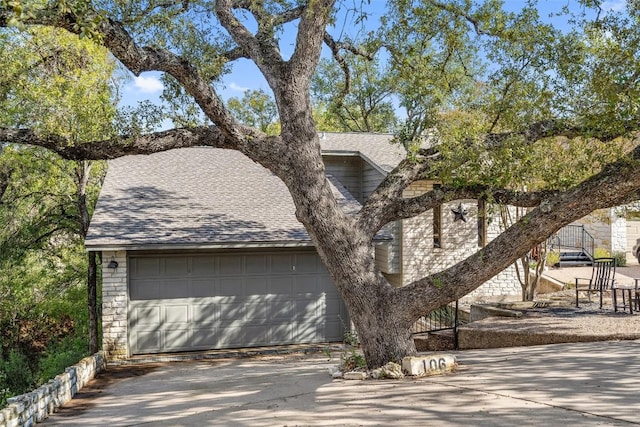 106 Center Cove Ii Loop, Spicewood, TX 78669 - view of front facade with a shingled roof and driveway