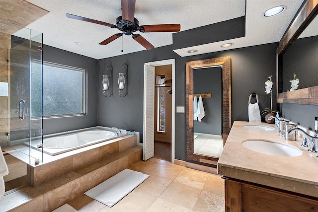 bathroom featuring ceiling fan, separate shower and tub, tile patterned floors, a textured ceiling, and vanity