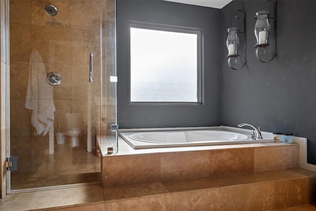 bathroom featuring shower with separate bathtub