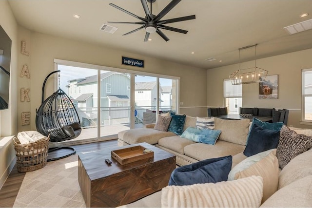 200 Archview Ln, Kingsland, TX 78639 - living room featuring a ceiling fan, plenty of natural light, light wood finished floors, a chandelier, and recessed lighting