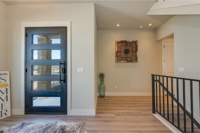 foyer entrance with light hardwood / wood-style flooring