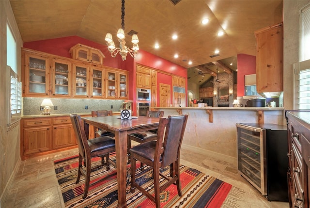 dining room featuring beverage cooler, lofted ceiling, and a notable chandelier