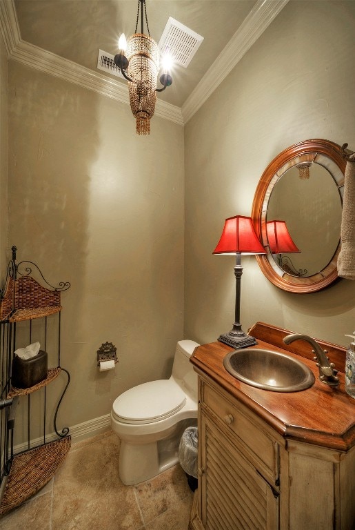 bathroom with ornamental molding, vanity, an inviting chandelier, tile patterned flooring, and toilet