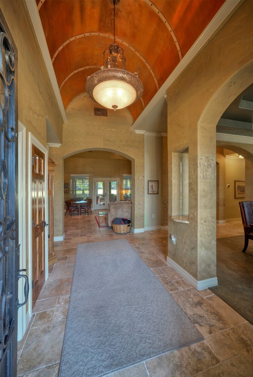 foyer entrance with high vaulted ceiling