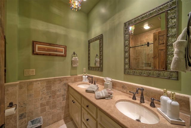 bathroom featuring vanity and tile walls