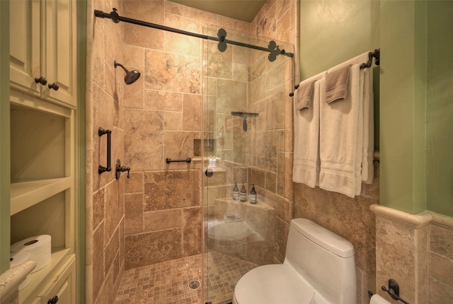 bathroom featuring toilet and walk in shower