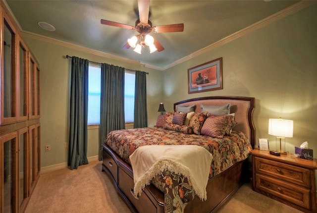 carpeted bedroom with ceiling fan and crown molding