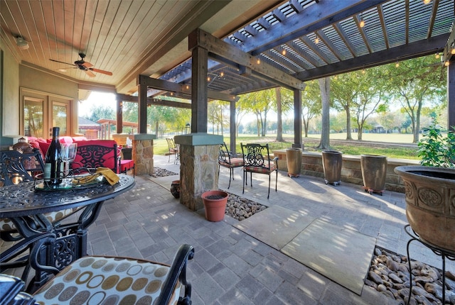 view of patio / terrace with a pergola and ceiling fan