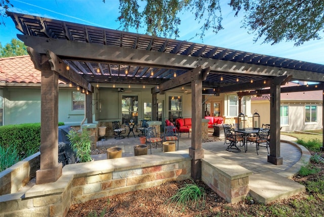 view of patio with a pergola, ceiling fan, and an outdoor hangout area